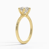 Delilah Twist Solitaire Engagement Ring with a Round cut diamond in yellow gold — side view