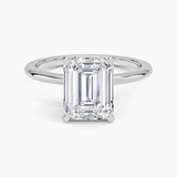 Four-Prong Comfort Fit 1.5mm Engagement Ring with a Emerald cut diamond in white gold — top view