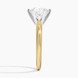 Classic Six-Prong Solitaire Engagement Ring with a Round cut diamond in yellow gold — profile view