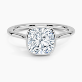 Petite Luna 1.5mm Bezel Engagement Ring with a Cushion cut diamond in white gold — top view