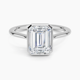 Petite Luna 1.5mm Bezel Engagement Ring with a Emerald cut diamond in white gold — top view