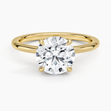 Hidden Heart Solitaire Engagement Ring with a Round cut diamond in yellow gold — top view