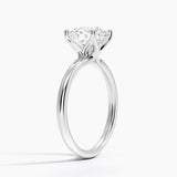Fleur Solitaire Engagement Ring with a Round cut diamond in white gold — side view