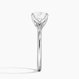 Fleur Solitaire Engagement Ring with a Round cut diamond in white gold — profile view