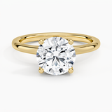 Fleur Solitaire Engagement Ring with a Round cut diamond in yellow gold — top view