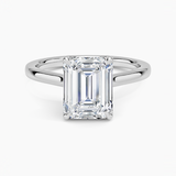 Elodie Cathedral Solitaire Engagement Ring with a Emerald cut diamond in white gold — top view