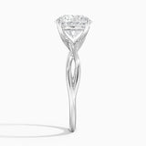 Alya Twist Solitaire Engagement Ring with a Round cut diamond in white gold — profile view