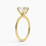 Entwined Solitaire Engagement Ring with a Round cut diamond in yellow gold — side view