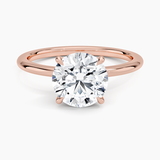 Petite 1.5mm Engagement Ring with a Round cut diamond in rose gold — top view