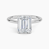 Petite 1.5mm Engagement Ring with a Emerald cut diamond in white gold — top view