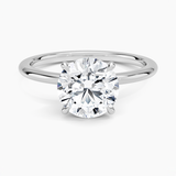 Petite 1.5mm Engagement Ring with a Round cut diamond in white gold — top view