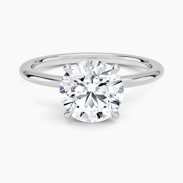Petite 1.5mm Engagement Ring with a Round cut diamond in white gold — top view