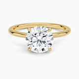 Petite 1.5mm Engagement Ring with a Round cut diamond in yellow gold — top view