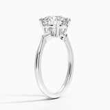 Petite Cometa Three Stone Diamond Engagement Ring with a Round cut diamond in white gold — side view