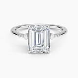 Petite Cometa Three Stone Diamond Engagement Ring with a Emerald cut diamond in white gold — top view