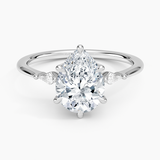 Petite Cometa Three Stone Diamond Engagement Ring with a Pear cut diamond in white gold — top view