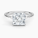 Petite Cometa Three Stone Diamond Engagement Ring with a Princess cut diamond in white gold — top view