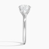 Reverie Solitaire Engagement Ring with a Round cut diamond in white gold — profile view