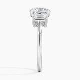 Luxe Rhiannon Three Stone Diamond Engagement Ring with a Round cut diamond in white gold — profile view