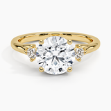 Floating Three Stone Diamond Engagement Ring with a Round cut diamond in yellow gold — top view