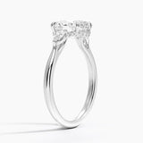 Floating Three Stone Pear Diamond Engagement Ring with a Oval cut diamond in white gold — side view