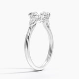 Floating Three Stone Pear Diamond Engagement Ring with a Round cut diamond in white gold — side view
