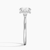 Floating Three Stone Pear Diamond Engagement Ring with a Round cut diamond in white gold — profile view