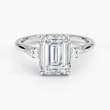 Floating Three Stone Pear Diamond Engagement Ring with a Emerald cut diamond in white gold — top view