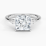 Floating Three Stone Pear Diamond Engagement Ring with a Princess cut diamond in white gold — top view