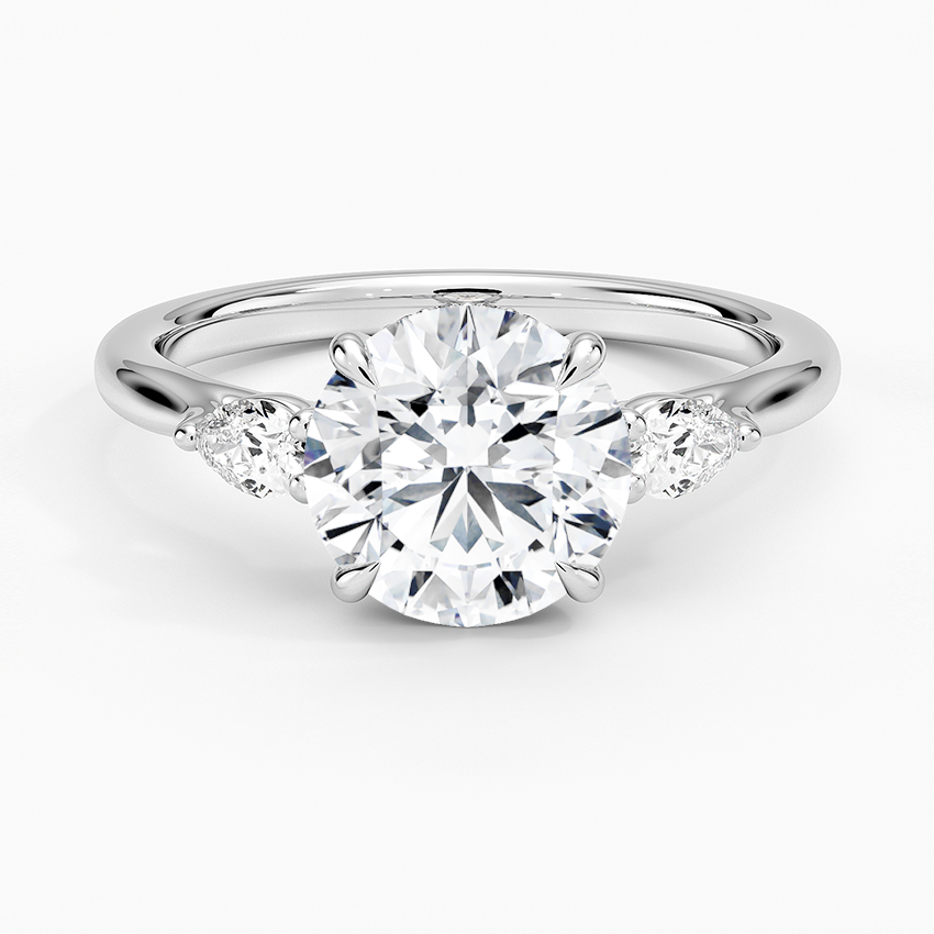 Floating Three Stone Pear Diamond Engagement Ring with a Round cut diamond in white gold — top view
