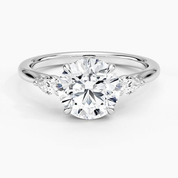 Floating Three Stone Pear Diamond Engagement Ring with a Round cut diamond in white gold — top view