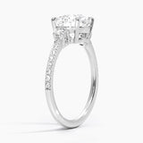 Lyra Three Stone Diamond Engagement Ring with a Round cut diamond in white gold — side view