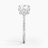 Lyra Three Stone Diamond Engagement Ring with a Round cut diamond in white gold — profile view