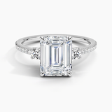 Lyra Three Stone Diamond Engagement Ring with a Emerald cut diamond in white gold — top view