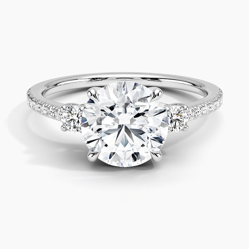 Lyra Three Stone Diamond Engagement Ring with a Round cut diamond in white gold — top view