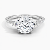 Lyra Three Stone Diamond Engagement Ring with a Round cut diamond in white gold — top view
