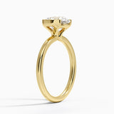 Annika Half Bezel Solitaire Engagement Ring with a Round cut diamond in yellow gold — side view