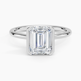 Annika Half Bezel Solitaire Engagement Ring with a Emerald cut diamond in white gold — top view