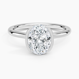 Annika Half Bezel Solitaire Engagement Ring with a Oval cut diamond in white gold — top view
