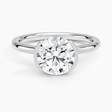Annika Half Bezel Solitaire Engagement Ring with a Round cut diamond in white gold — top view