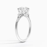 Delilah Three Stone Pear Diamond Engagement Ring with a Round cut diamond in white gold — side view