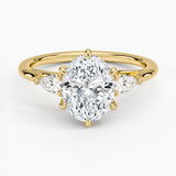 Delilah Three Stone Pear Diamond Engagement Ring with a Oval cut diamond in yellow gold — top view
