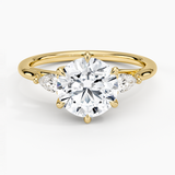 Delilah Three Stone Pear Diamond Engagement Ring with a Round cut diamond in yellow gold — top view