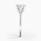 Ballad Half Coverage Diamond Engagement Ring with a Round cut diamond in white gold — profile view