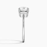Vertical Baguette Three Stone Diamond Engagement Ring with a Round cut diamond in white gold — profile view