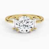 Vertical Baguette Three Stone Diamond Engagement Ring with a Round cut diamond in yellow gold — top view