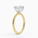 Adorned Mixed Metal Diamond Engagement Ring with a Round cut diamond in yellow gold — side view