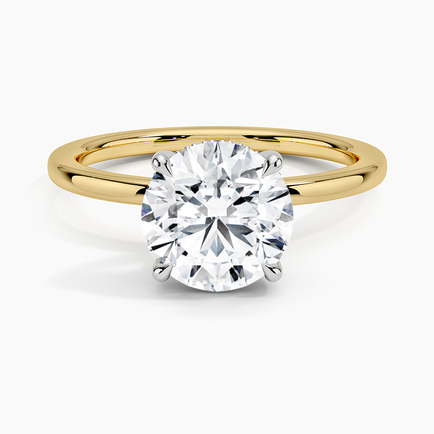 Adorned Mixed Metal Diamond Engagement Ring with a Round cut diamond in yellow gold — top view