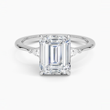 Aria Three Stone Diamond Engagement Ring with a Emerald cut diamond in white gold — top view