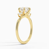Delilah Three Stone Diamond Engagement Ring with a Round cut diamond in yellow gold — side view
